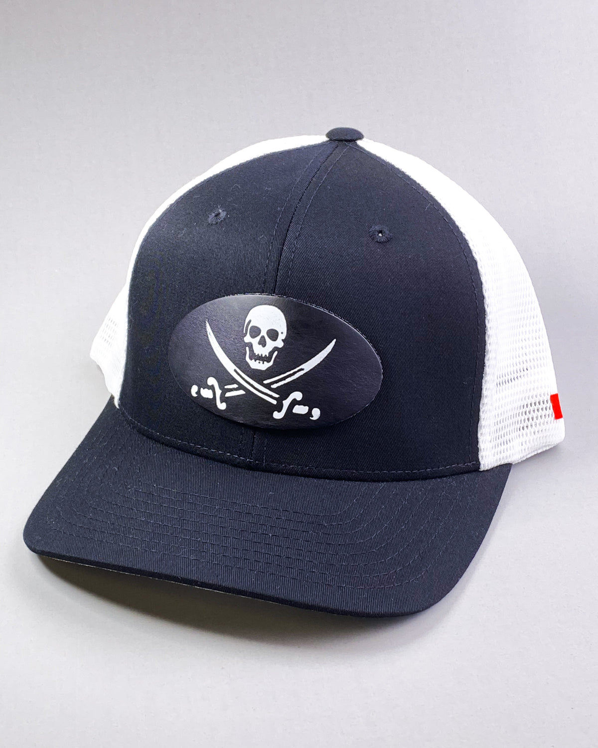 Bravo Cay hat in black/white with pirate themed design leather patch